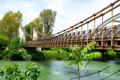 Bridge over river against sky