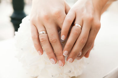 Cropped hands of lesbian couple holding hands