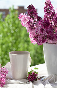 Close-up of flower vase on table