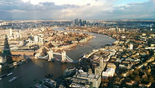 High angle view of tower bridge over thames river in city against sky seen from the shard