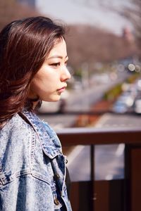 Close-up of woman looking away outdoors