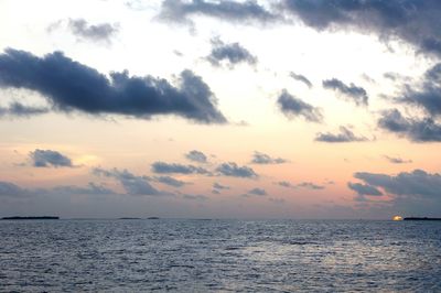 Scenic view of sea against sky at sunset