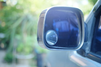 Reflection of side-view mirror of car