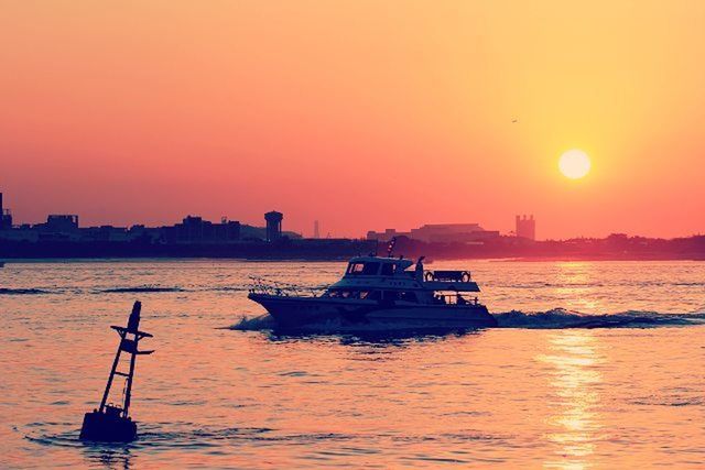 sunset, transportation, nautical vessel, water, mode of transport, sun, orange color, boat, waterfront, sea, silhouette, scenics, beauty in nature, sailing, tranquil scene, nature, tranquility, sky, idyllic, clear sky