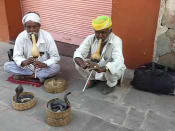 Men holding ice cream cone