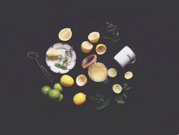 High angle view of fruits on table against black background