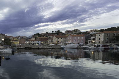 Buildings in town against sky