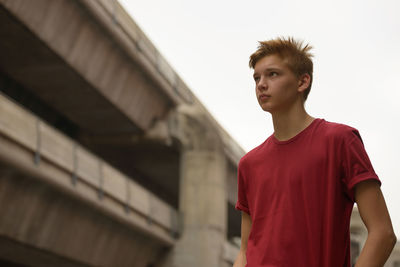 Portrait of teenage boy looking away