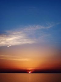 Scenic view of sea against sky at sunset