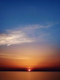 Scenic view of calm sea at sunset