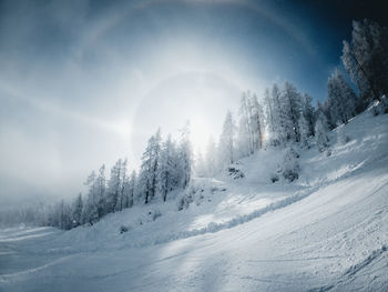 Sun halo on a cold winter day in the zauchensee ski resort, austria.