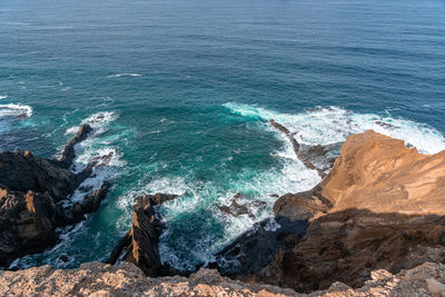 High angle view of rocks in sea