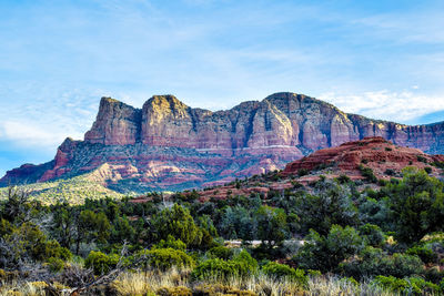 View of rock formations on landscape against sky