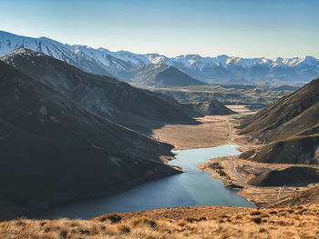 Scenic view of snowcapped mountains against clear sky