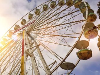 Low angle view of ferris wheel against sky