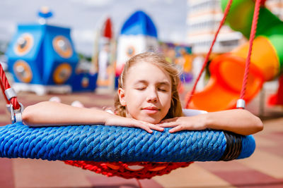 Portrait of girl relaxing outdoors