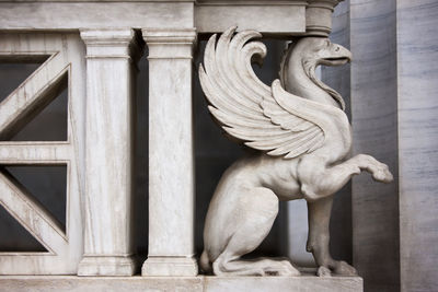 Close-up of marble vulture statue at national library athens