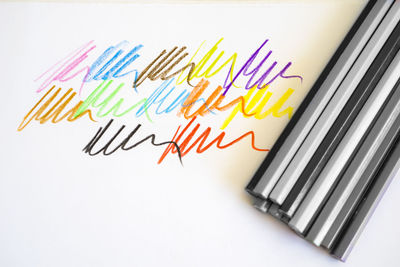 Close-up of colorful pencils on white background