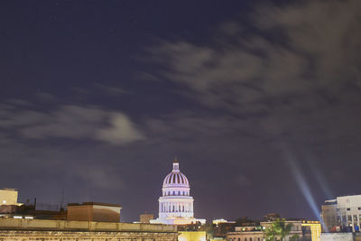 View of buildings in city at night