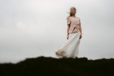 Woman standing on field