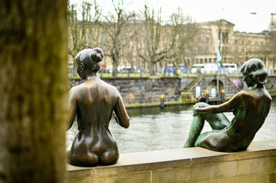 Statue against trees