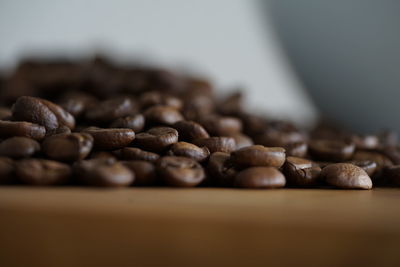 Close-up of coffee beans on table