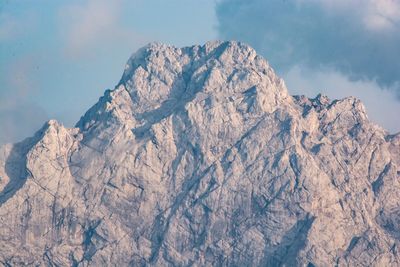Low angle view of rock formation against sky