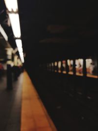 Close-up of train at railroad station at night