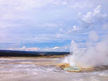 Old faithful geyser erupting in yellowstone national park