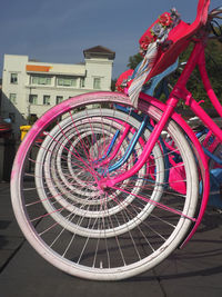 Directly above shot of bicycle by building against sky