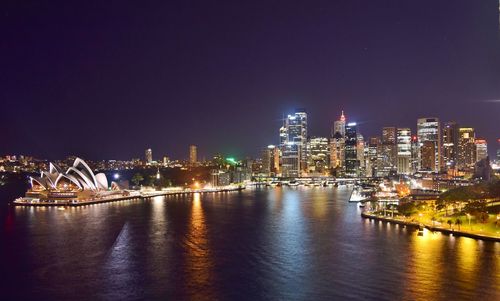 Illuminated city at waterfront