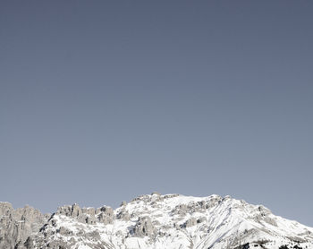 Scenic view of snowcapped mountains against clear sky