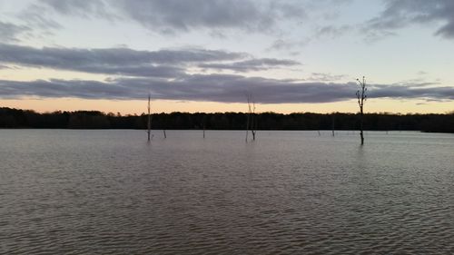 Scenic view of landscape against sky at sunset