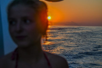 Portrait of man against sea during sunset