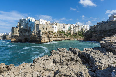 Rough and breathtaking sea. polignano a mare sunlit. puglia. italy