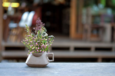 Close-up of flower vase on table
