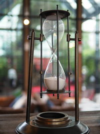 Close-up of clock on table