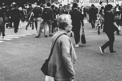 People walking on street in city