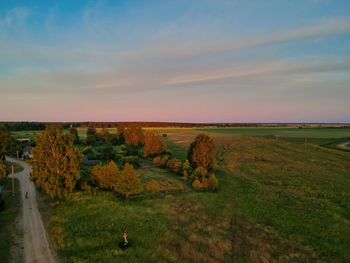 Scenic view of field against sky during sunset