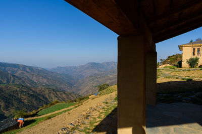 Scenic view of mountains against clear blue sky