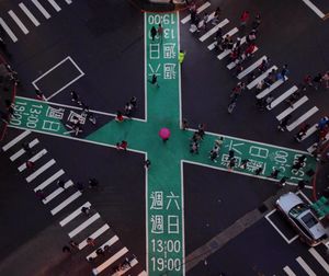 High angle view of people on zebra crossing in city