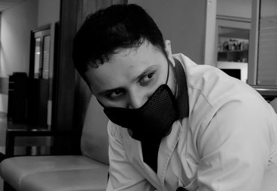 Portrait of young man at home