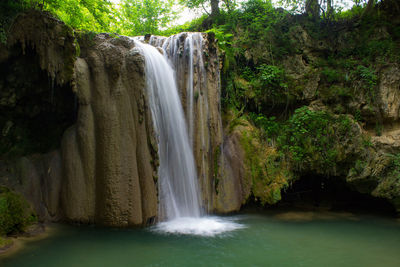 Scenic view of waterfall in forest