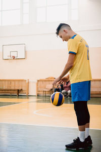 Full length of man playing with ball