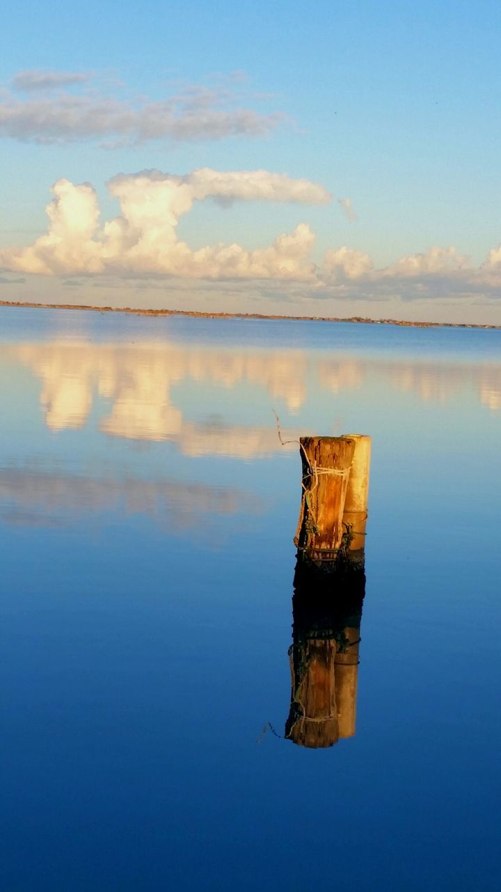 water, tranquil scene, tranquility, sky, reflection, scenics, waterfront, beauty in nature, sea, lake, nature, blue, idyllic, calm, sunset, cloud, dusk, cloud - sky, outdoors, no people