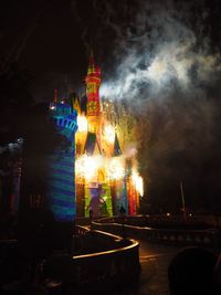 Illuminated building against sky at night