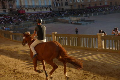 People riding horses at town square