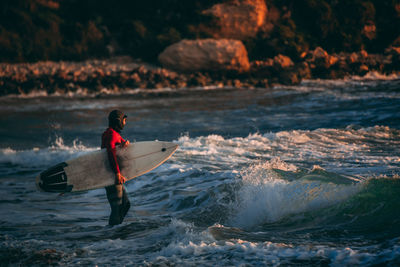 Man surfing in sea