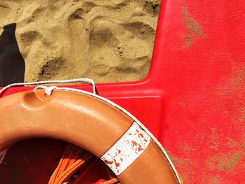 High angle view of inflatable ring on sand at beach