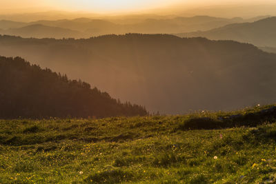 Scenic view of landscape against sky during sunset